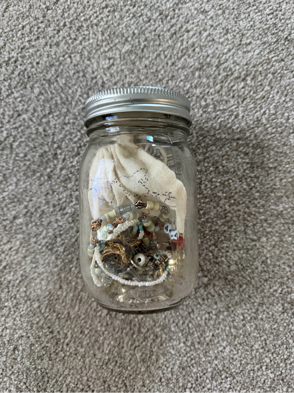 Glass Mason Jar Filled with Beaded Jewelry and Trinkets - Clear